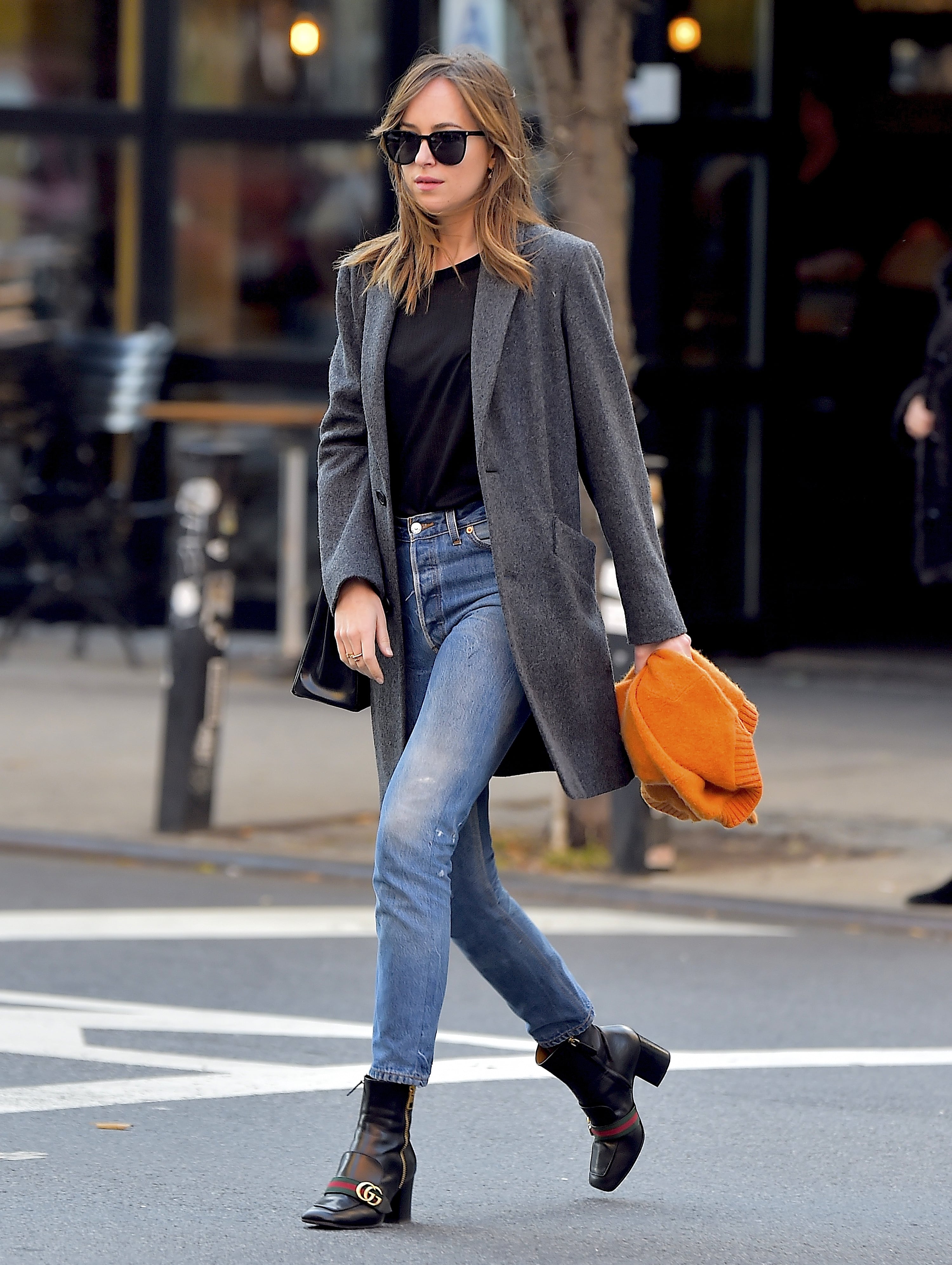 Dakota Johnson Wore Wide-Leg Jeans With a Gucci Bag