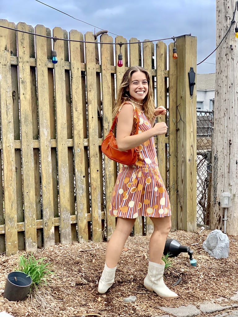 I just picked up this '90s shoulder bag from Topshop, and it instantly reminded me of Jenna's purse in the movie. I wore it with a quirky, colorful Marc Jacobs dress, but I added Western influence with my Dolce Vita boots. As far as jewelry goes, Jenna might love butterflies, but I'm a fan of shells.