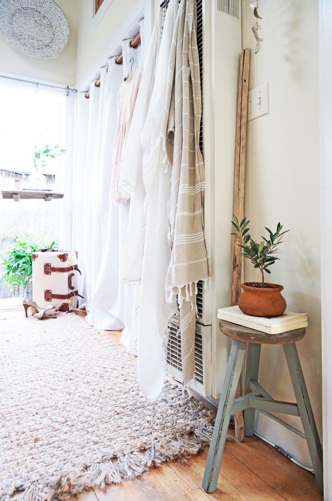 Hanging tapestries and plants go a long way to conceal and enhance Whitney's home. "Plants instantly make a space feel alive, fresh, and welcoming, and can transform a room of any size," she explains. Plus, for the budget-conscious, she adds, "Greenery is an easy way to regularly update the style of your home without hurting your wallet or the environment." Hanging tapestries and plants go a long way to conceal and enhance Whitney's home. "Plants instantly make a space feel alive, fresh, and welcoming, and can transform a room of any size," she explains. Plus, for the budget-conscious, she adds, "Greenery is an easy way to regularly update the style of your home without hurting your wallet or the environment."