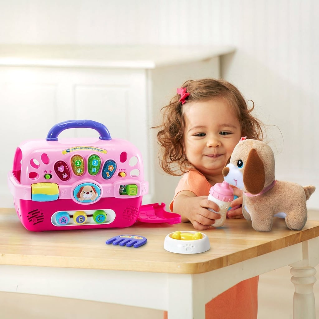 A two year old baby girl toddler child playing with toy ...