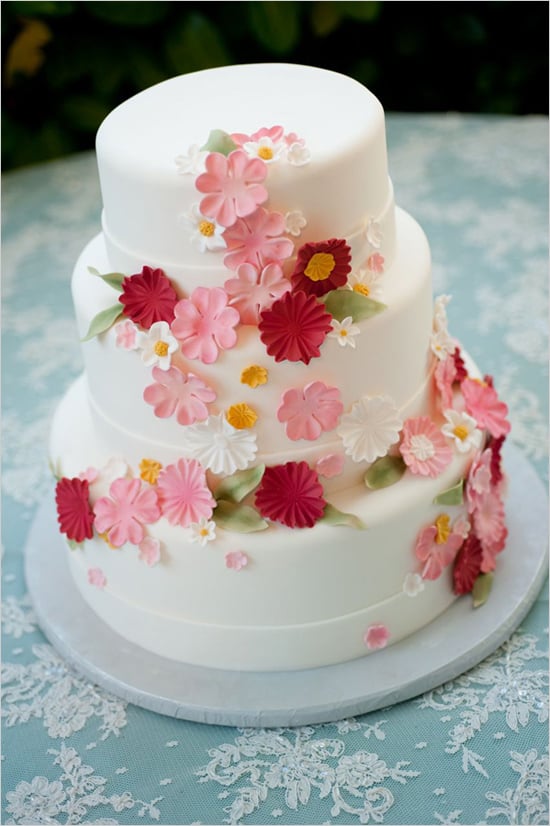 Reds, pinks, and whites aren't just for Valentine's Day. All three colors come together beautifully to make this one charming cake. 
Photo by Shelly Kroeger Photography via Wedding Chicks