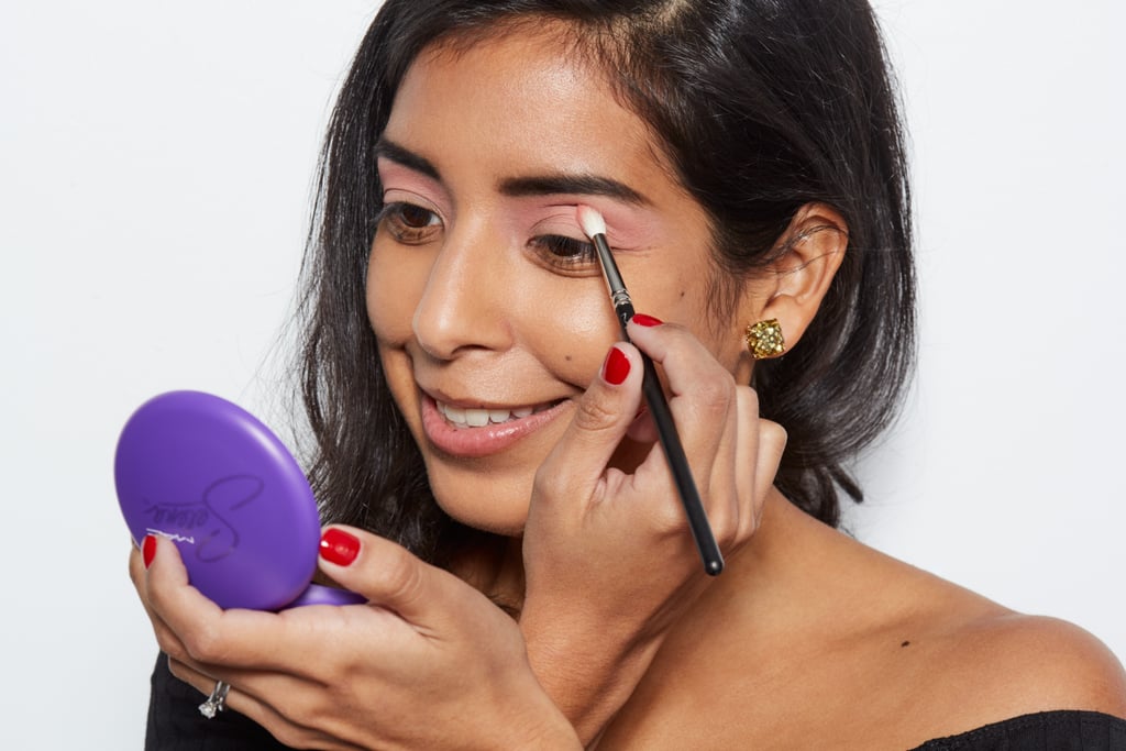 Go over the soft pink shade only on the crease of your eyelid with Fotos y Recuerdos Eye Shadow ($17), a baby-pink hue, with a small crease brush (like MAC 217 Blending Brush ($25)), and using a windshield wiping motion.

"You are not looking to create a lot of contrast between the base eye shadow and the crease; you're looking to see just a slight change in tint on the crease," Chantel said.

If you didn't get your hands on the MAC x Selena collection, try Paradisco Eye Shadow ($16).