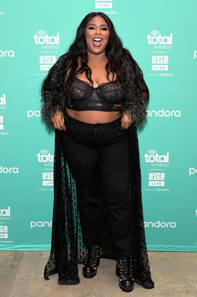 Yep, Lizzo can make even the simplest black outfit look incredible. Instead of a simple jeans and t-shirt combo, the singer went for a black bralette over a pair of high-rise black jeans and tied the look together with a sheer black cardigan that (of course) has fuzzy faux fur cuffs.