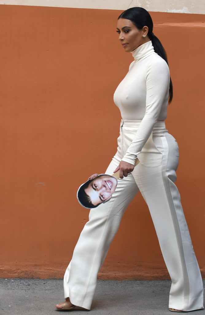 Kim Kardashian With Cutout of Rob Kardashian's Face