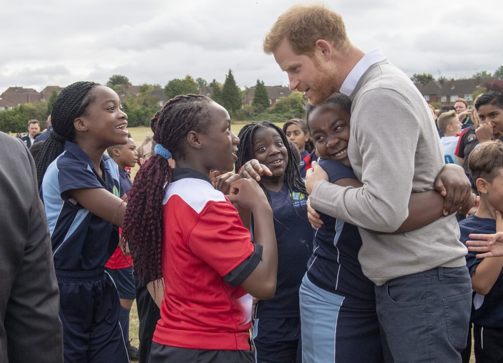 Prince Harry Hugs Kids at Lealands High School