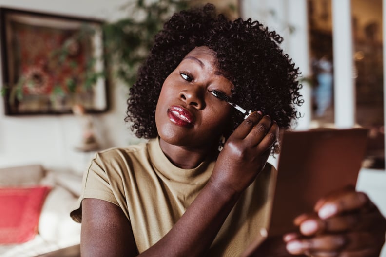 woman applying makeup
