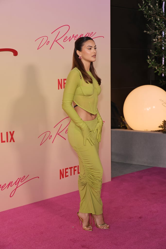 Camila Mendes Wears Green Versace Corset Top, Low-Rise Skirt
