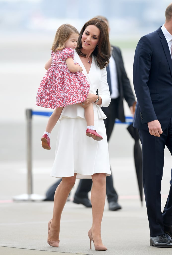 Kate looking on at an adorable Princess Charlotte.
