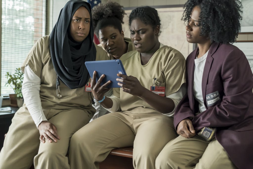 What could Taystee (Danielle Brooks), Cindy (Adrienne C. Moore), Janae (Vicky Jeudy), and Alison (Amanda Stephen) be looking at on that iPad? Judging by Taystee's reaction, it's not a cat video.