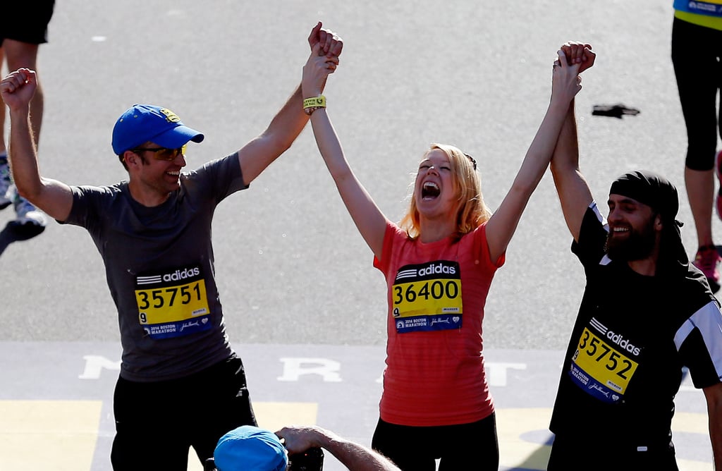 Boston Marathon bombing survivor Adrianne Haslet-Davis celebrated as she crossed the finish line one year later.