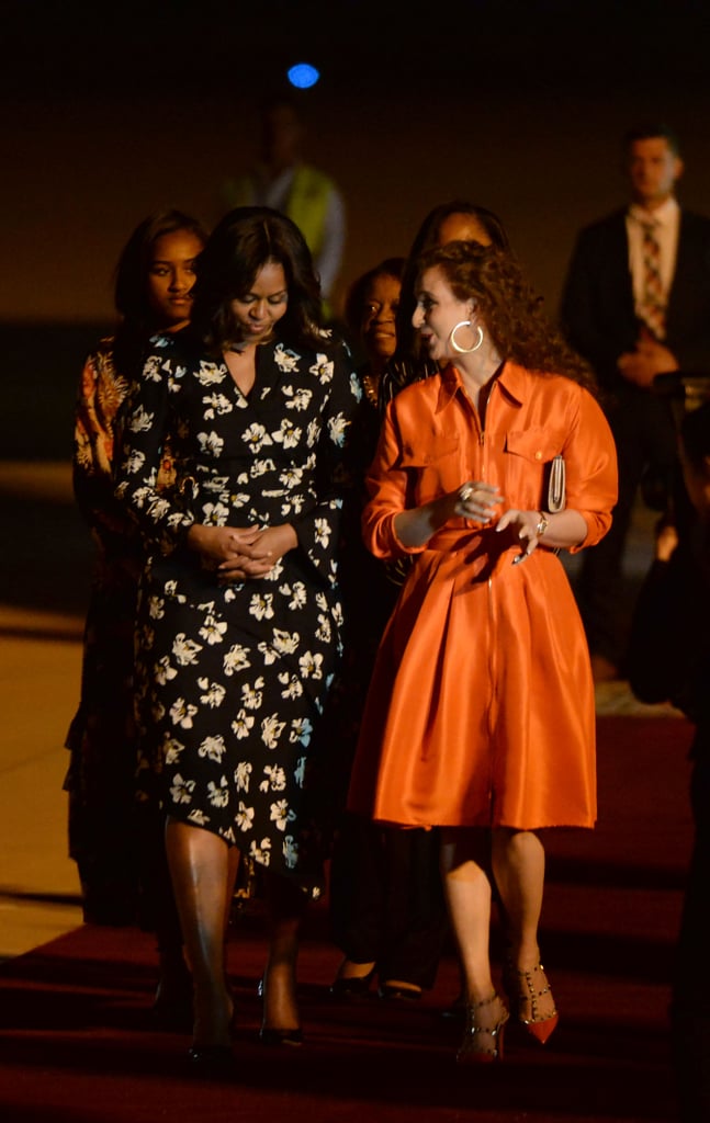 Michelle Obama touched down in Marrakesh in a floral Proenza Schouler wrap dress.