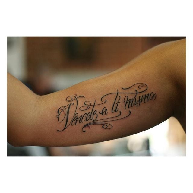 Karol G’s “Vénecete a ti misma” Arm Tattoo