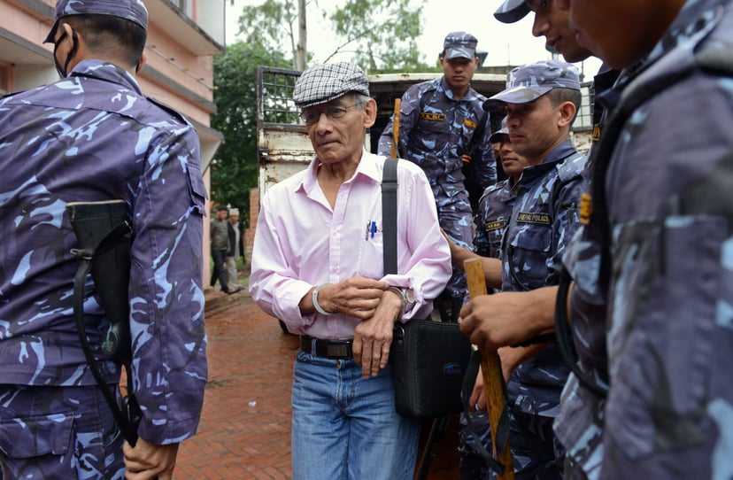 French serial killer Charles Sobhraj (C) is brought to the district court for a hearing on a case related to the murder of Canadian backpacker Laurent Ormond Carriere, in Bhaktapur on May 26, 2014. Sobhraj, a French citizen who is serving a life sentence 