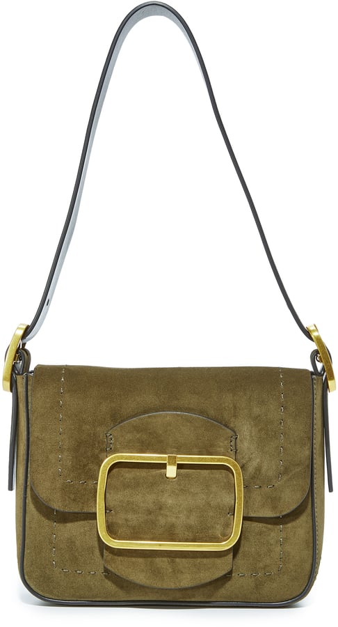 In a notice-me color with subtle '70s vibes, this Tory Burch Sawyer Small Shoulder Bag ($495) is a contemporary remix of a vintage favorite.