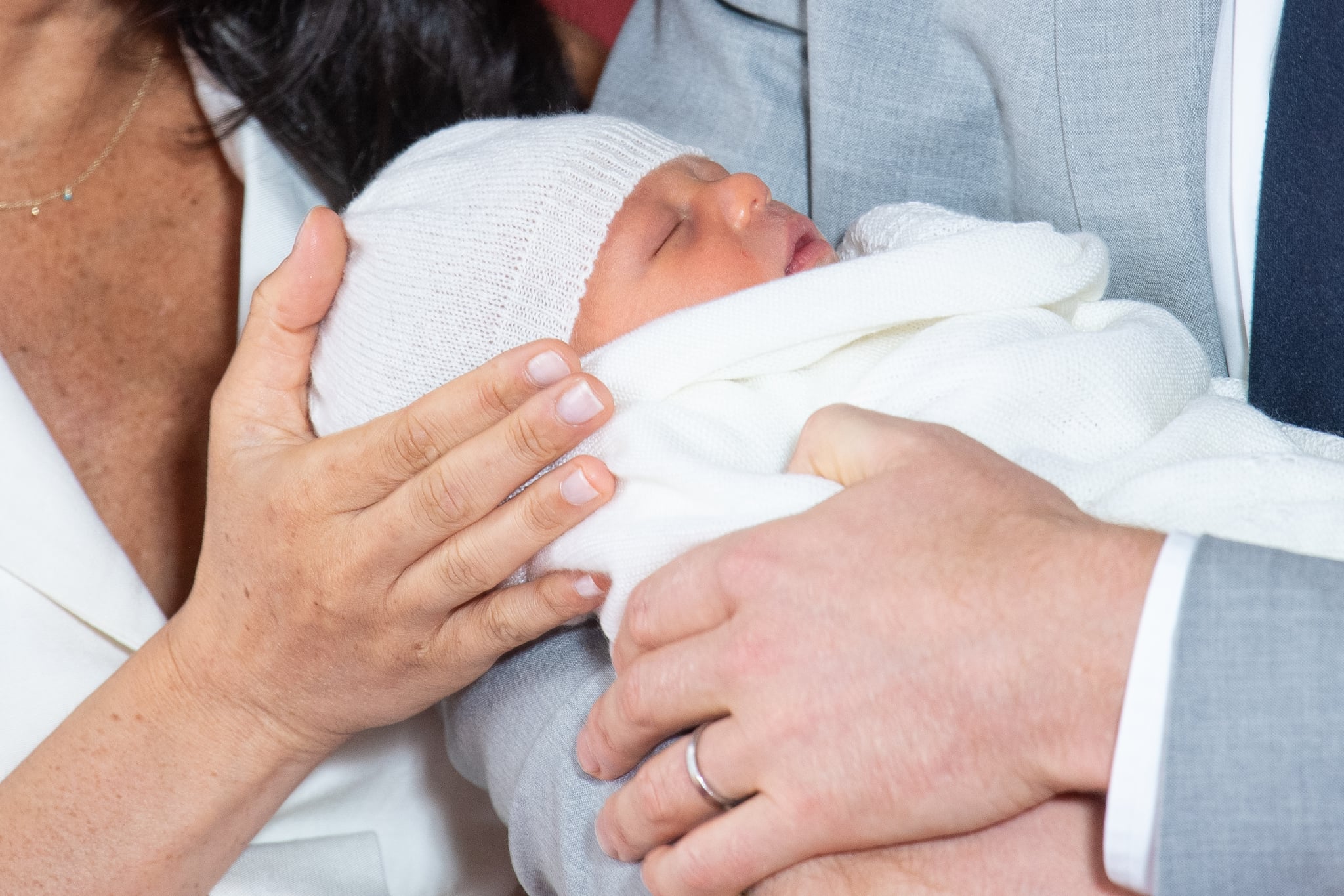 Britain's Prince Harry, Duke of Sussex (R), and his wife Meghan, Duchess of Sussex, pose for a photo with their newborn baby son in St George's Hall at Windsor Castle in Windsor, west of London on May 8, 2019. (Photo by Dominic Lipinski / POOL / AFP)        (Photo credit should read DOMINIC LIPINSKI/AFP/Getty Images)