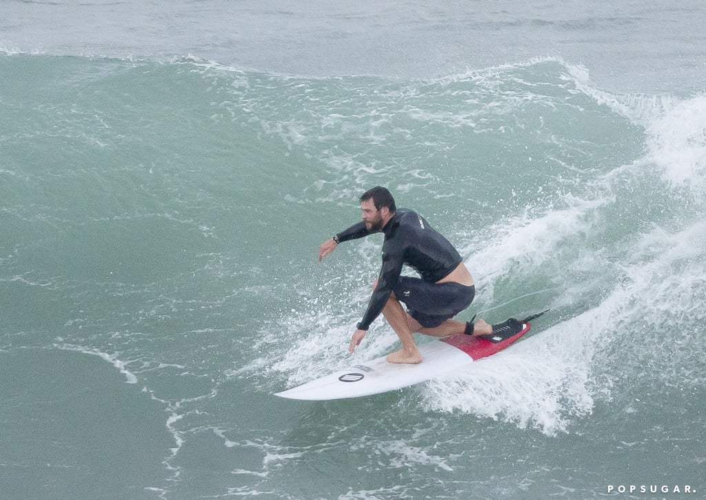 Liam Hemsworth Taking Pictures of Chris Surfing in Australia