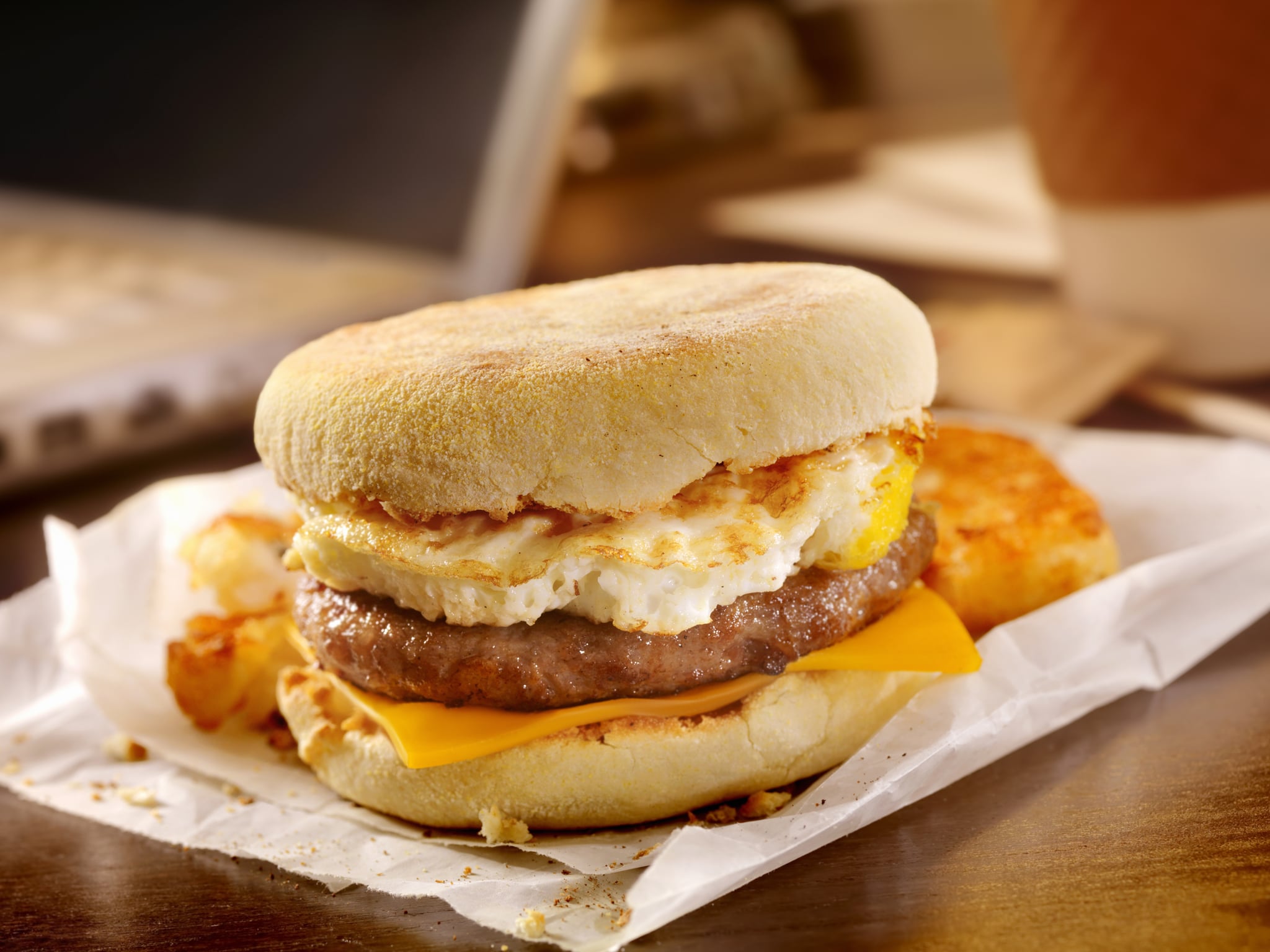 Sausage and Egg Breakfast Sandwich with a Hash brown Patty at your Desk - Photographed on a Hasselblad H3D11-39 megapixel Camera System