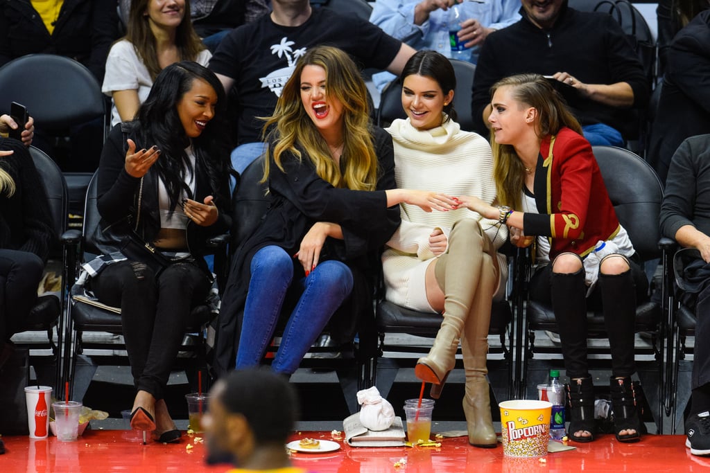 Kendall Jenner was in a Khloé Kardashian and Cara Delevingne sandwich at the LA Lakers vs. LA Clippers game on Wednesday.