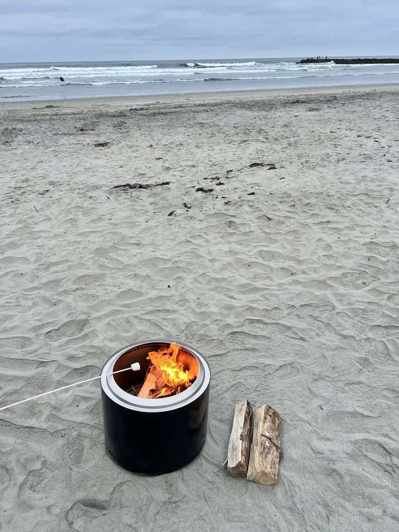 cooking smores on the beach over a solo stove burner and stand