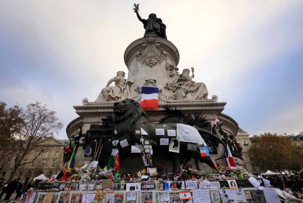 Tributes were left at the base of the Statue de Marianne in Paris.