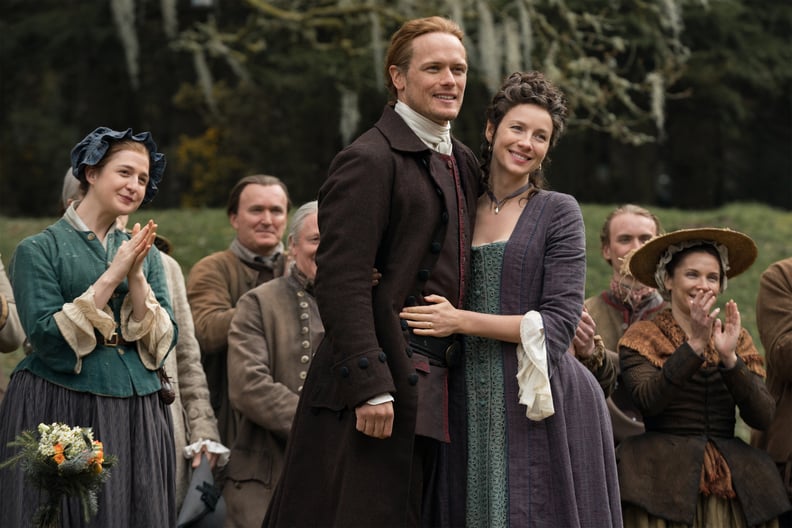 OUTLANDER, from left: Caitlin O'Ryan, Sam Heughan, Caitriona Balfe, The Fiery Cross, (Season 5, Episode 501, aired Feb. 16, 2020). photo: Aimee Spinks / Starz / Courtesy Everett Collection