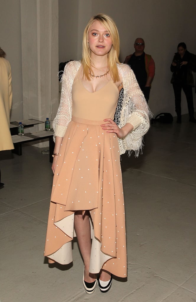 Dakota Fanning posed for photos at the Rodarte runway show on Tuesday evening.