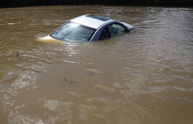 A car is nearly fully submerged by the water in Port Vincent, LA.