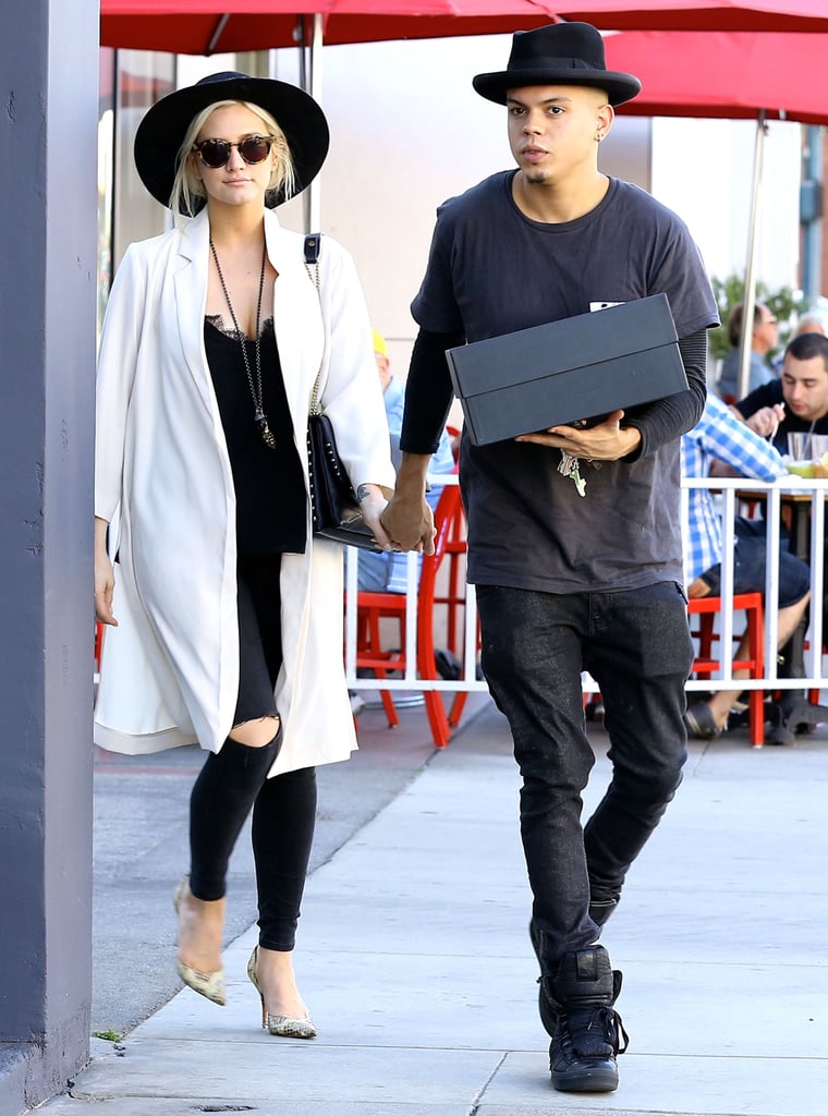 Ashlee Simpson covered up her baby bump while out and about in LA with Evan Ross on Saturday.