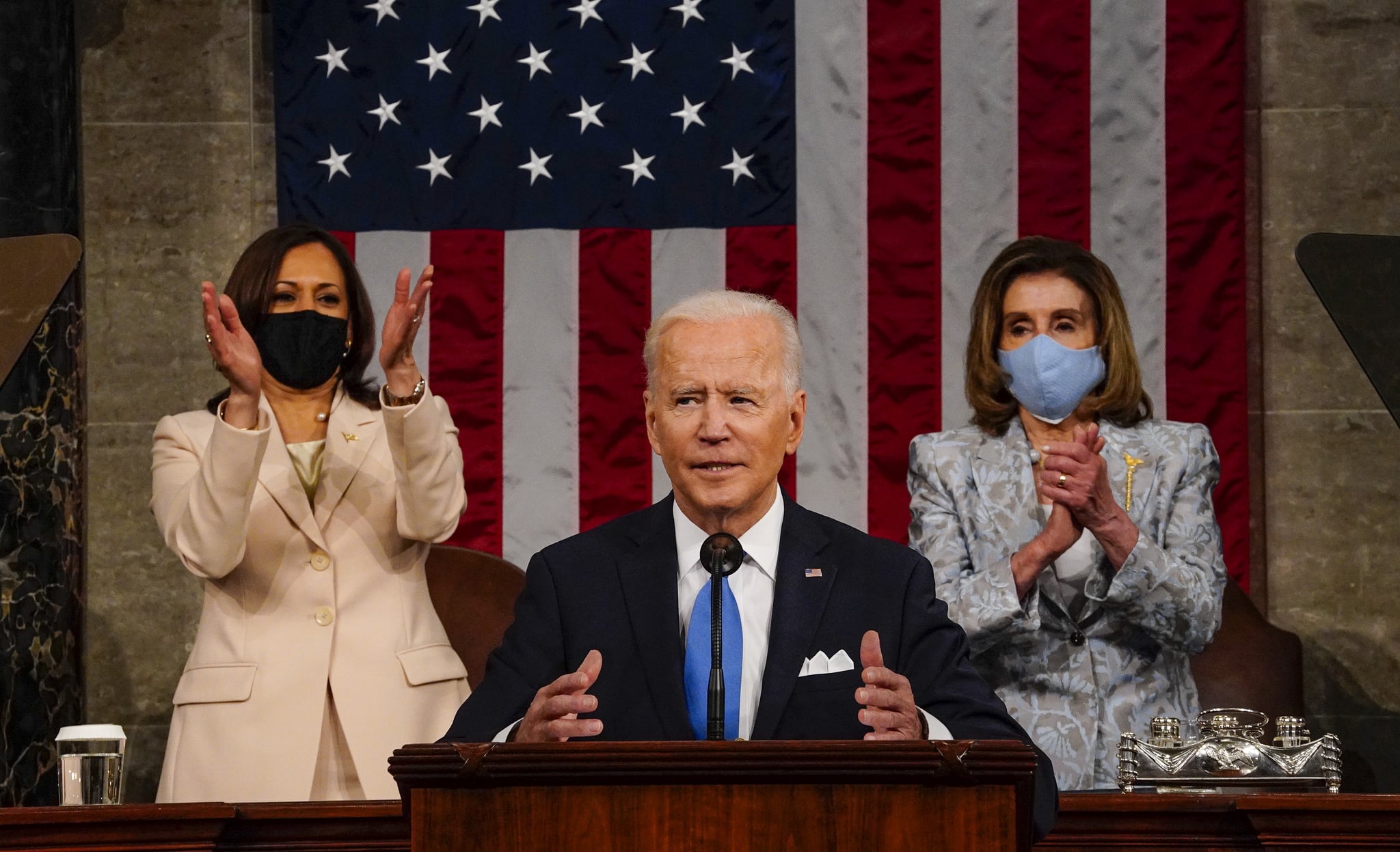 WASHINGTON, DC - APRIL 28:  President Joe Biden addresses a joint session of Congress, with Vice President Kamala Harris and House Speaker Nancy Pelosi (D-CA) on the dais behind him on April 28, 2021 in Washington, DC. On the eve of his 100th day in office, Biden spoke about his plan to revive America's economy and health as it continues to recover from a devastating pandemic. He delivered his speech before 200 invited lawmakers and other government officials instead of the normal 1600 guests because of the ongoing COVID-19 pandemic.  (Photo by Melina Mara-Pool/Getty Images)