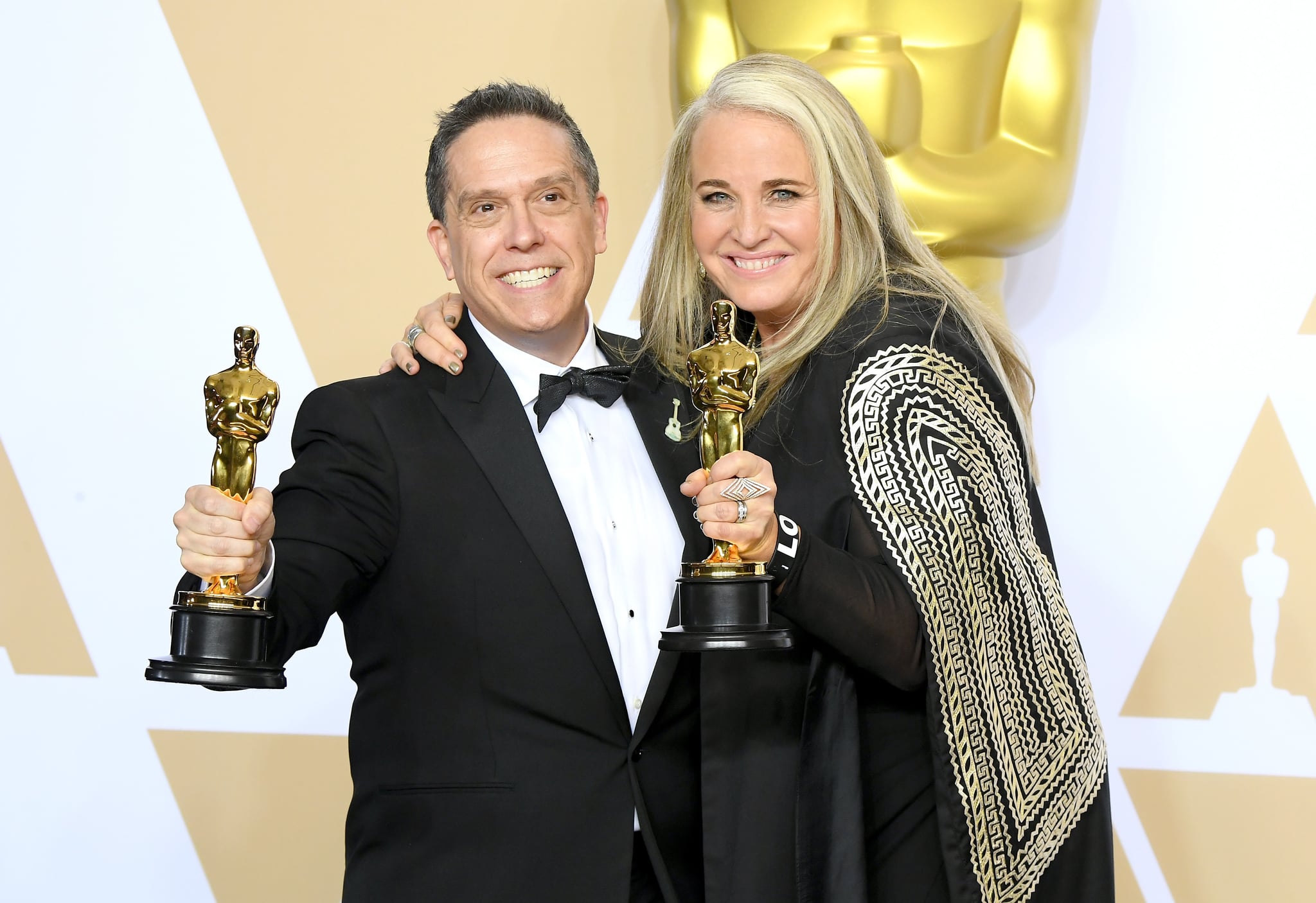 HOLLYWOOD, CA - MARCH 04:  Director Lee Unkrich (L) and Producer Darla K. Anderson, winners of the Animated Feature award for Coco pose in the press room during the 90th Annual Academy Awards at Hollywood & Highland centre on March 4, 2018 in Hollywood, California.  (Photo by Steve Granitz/WireImage)