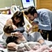 Mom Breastfeeding Toddler While in Labor