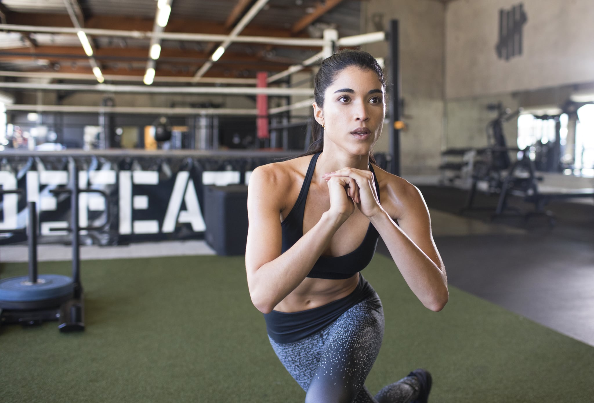 Female athlete exercising at boxing gym