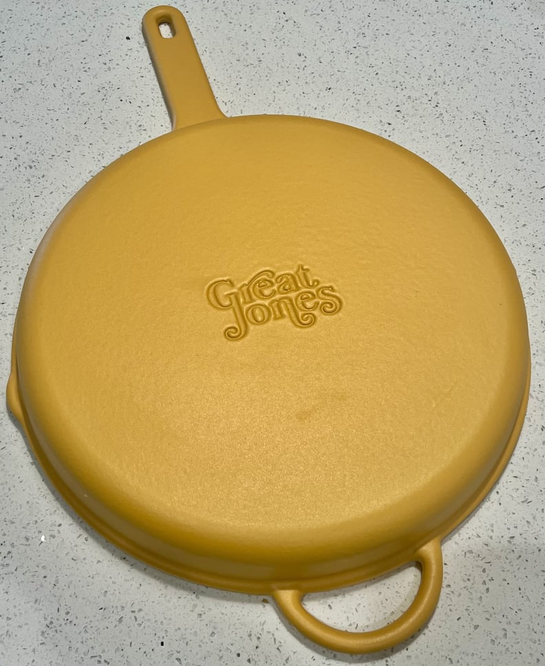 The Great Jones King Sear cast iron pan in Mustard yellow upside down.
