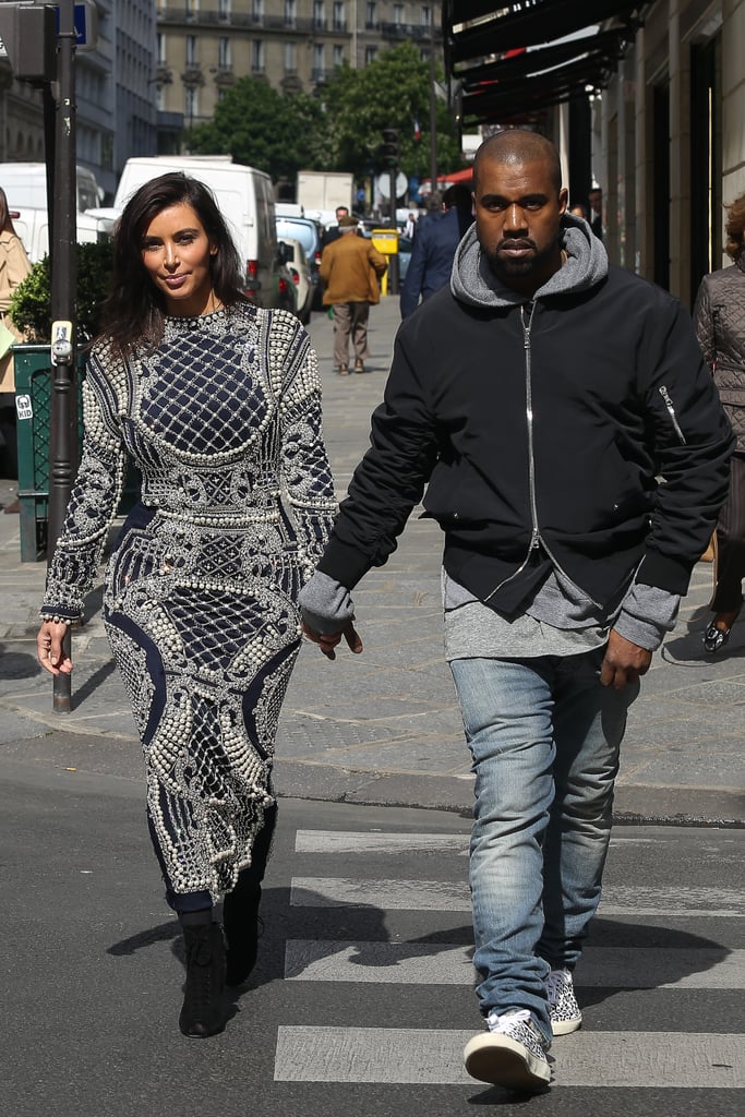 Kim took the streets of Paris in a black and white detailed maxi dress.