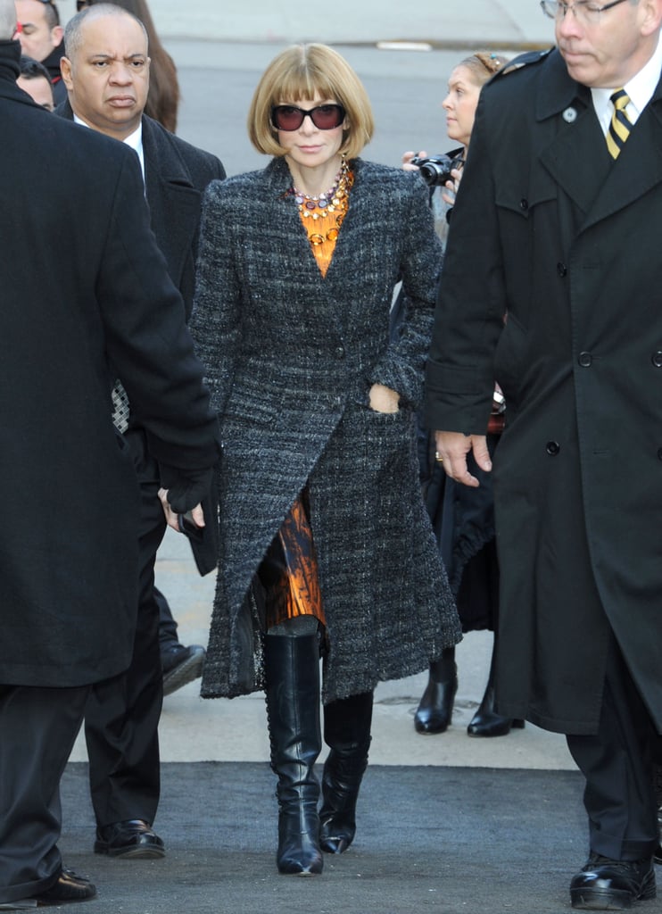 Anna Wintour arrived at Michael Kors in a printed satin sheath, long tweed coat, and black leather boots.
Anna Wintour arrived at Michael Kors in a printed satin sheath, long tweed coat, and black leather boots.