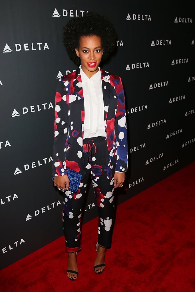 Solange Knowles struck a pose in a cropped splatter-print Diane von Furstenberg pantsuit at a pre-Grammy party in LA. Dainty ankle-strap sandals, a sequined cobalt Jimmy Choo clutch, and a few statement rings took her eye-catching ensemble to new heights.