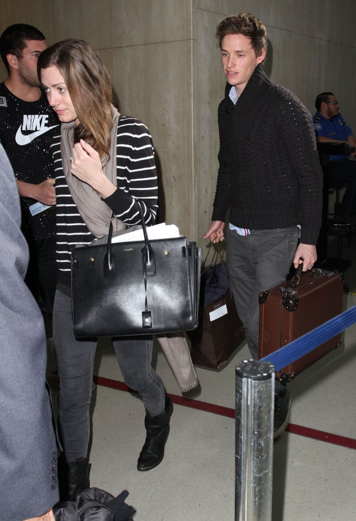 Newlyweds Eddie Redmayne and Hannah Bagshawe arrived at LAX on Wednesday.