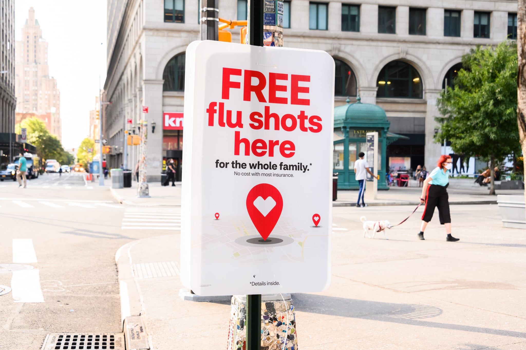 NEW YORK, NEW YORK - AUGUST 18: A sign offering free flu shots in the East Village as the city continues Phase 4 of re-opening following restrictions imposed to slow the spread of coronavirus on August 18, 2020 in New York City. The fourth phase allows outdoor arts and entertainment, sporting events without fans and media production. (Photo by Noam Galai/Getty Images)