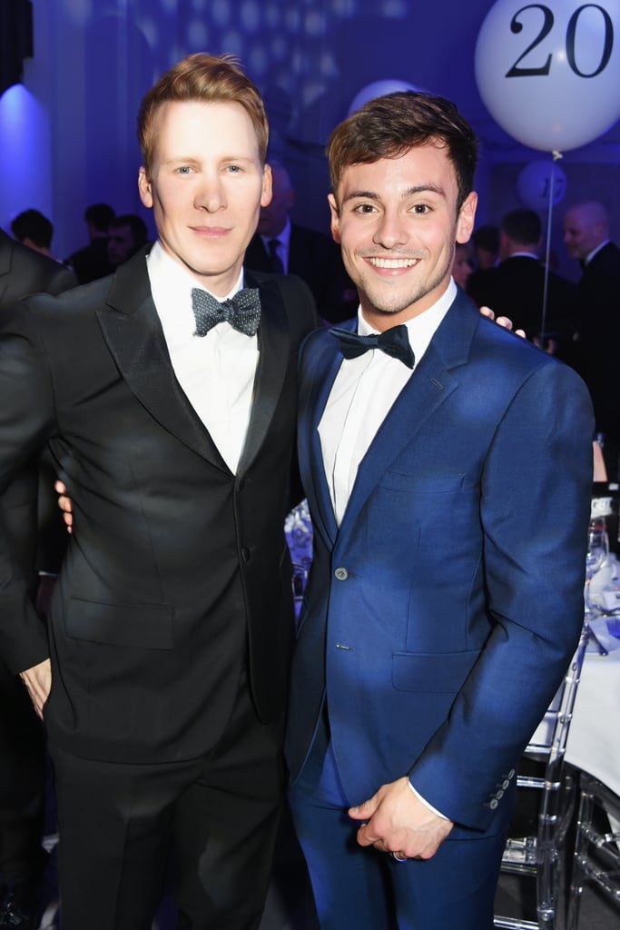 Tom Daley and Dustin Lance Black had that newlywed glow when they attended the British LGBT Awards in London on Friday. The pair, who tied the knot in an enchanting ceremony at the Bovey Castle Hotel earlier this month, looked dapper in their suits and matching bow ties as they made their debut as a married couple at the event. Tom and Dustin were both honoured with the influencer of the year award, while Caitlyn Jenner took home the loud and proud award for using her platform to campaign for trans rights. 
The nearly 23-year-old Olympic diver began dating the 42-year-old screenwriter in the Summer of 2013, shortly before he came out as bisexual on YouTube. "My life changed massively when I met someone, and they make me feel so happy, so safe, and everything just feels great," he said in the video. "That someone is a guy. It did take me by surprise a little bit."