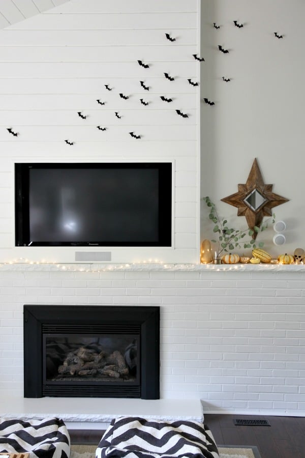 I  bought two sets of removable 3D bats and filled the area above the TV with them. (A ladder was involved.) I love these bats! Don’t let the reviews fool you. A few people were disappointed that the bats aren’t larger but I actually prefer this size. The bats are plastic and you bend them to get the 3D effect. They also come with removable stickers. I’m not sure how the adhesive will hold up after one season but I can always break out my trusty putty tabs if necessary. These bats are definitely going to be a mainstay of our Halloween décor.