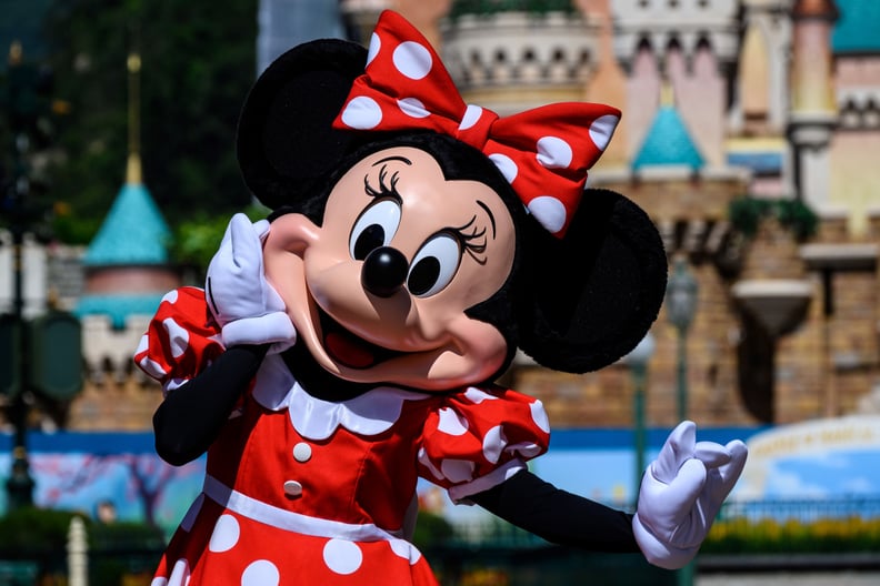 A cast member dressed as cartoon character Minnie Mouse takes part in the official reopening ceremony of Hong Kong's Disneyland on June 18, 2020, following nearly five months of closure in a fresh boost for a city that has largely managed to defeat the CO