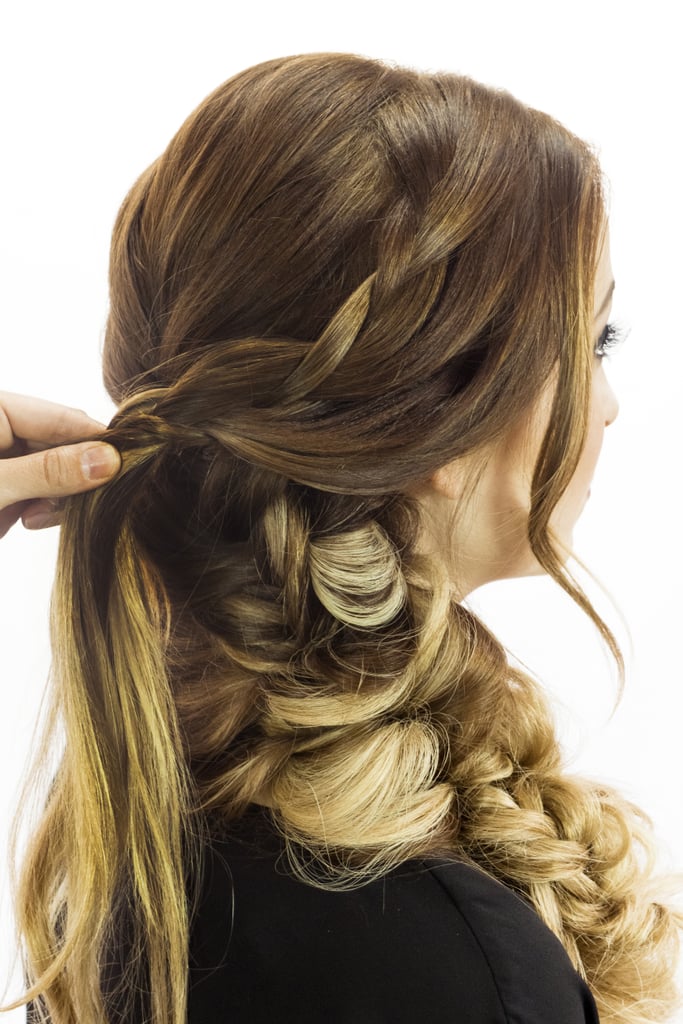 Now you can finally let down the two side sections! Use each piece to create two separate, loosely woven french braids that start at the part, then join together to create one plait at the center back. For more guidance on french braids, go here.