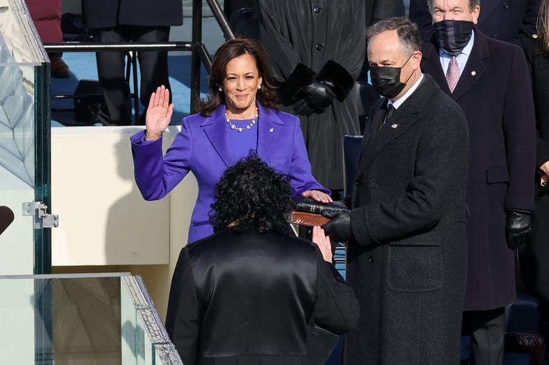 WASHINGTON, DC - JANUARY 20:  Kamala Harris is sworn as U.S. Vice President by U.S. Supreme Court Associate Justice Sonia Sotomayor as her husband Doug Emhoff looks on at the inauguration of U.S. President-elect Joe Biden on the West Front of the U.S. Cap