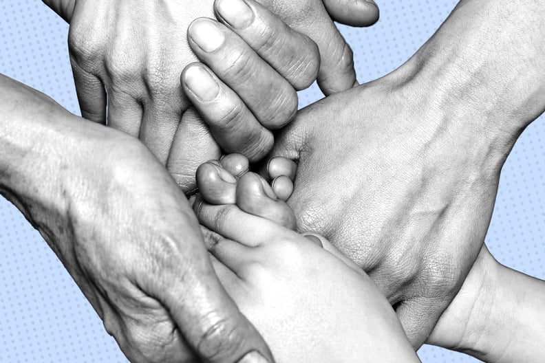 A black and white photo shows multiples hands holding each other.