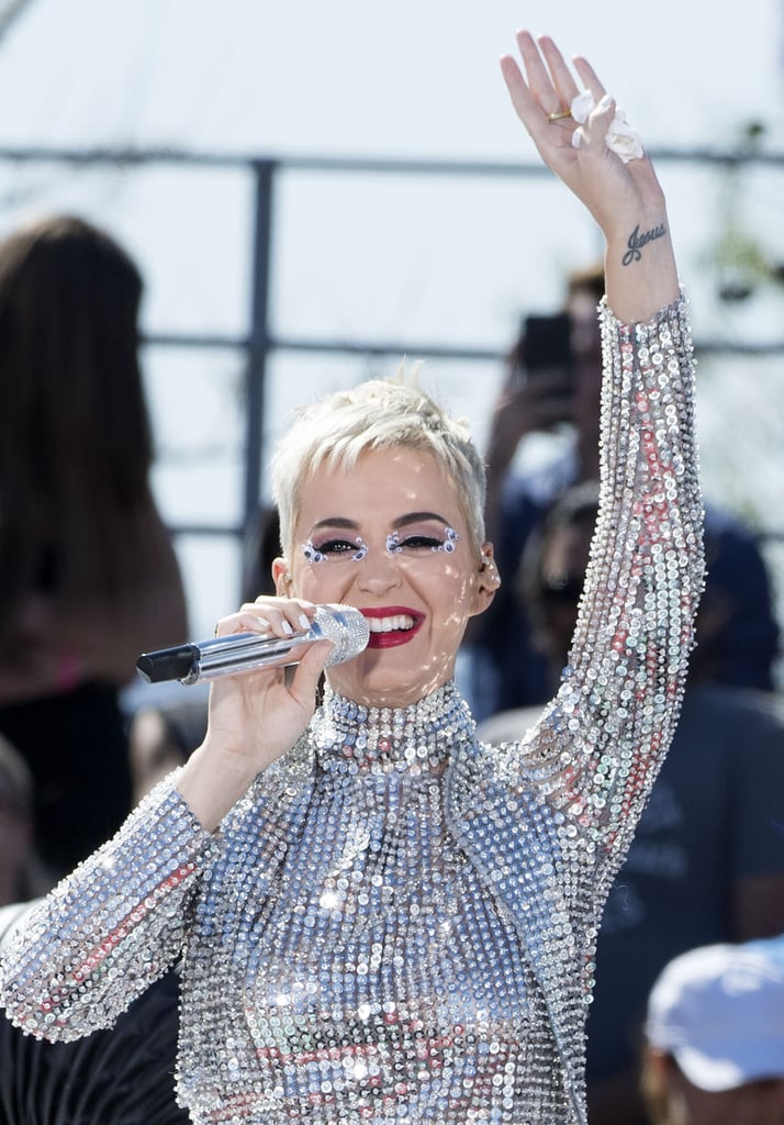 It looks like Katy Perry is really serious about ending her feud with Taylor Swift. On Monday, the 32-year-old singer took another step toward her reconciliation with the pop star during her LA concert, which capped off her 72-hour Witness World Wide YouTube special. While performing her single "Swish Swish," Katy reportedly changed a key lyric in the song, which many have speculated is aimed at Taylor. Instead of singing, "Don't you come for me," in the first verse, Katy belted out, "God bless you on your journey, oh baby girl." 
The surprising change comes just two days after Katy officially forgave Taylor during an interview with Thrive Global's Arianna Huffington. "I forgive her and I'm sorry for anything I ever did, and I hope the same from her," she said. "I think it's time. There are bigger fish to fry, and there are real problems in the world." So what do you say, Taylor? Truce?