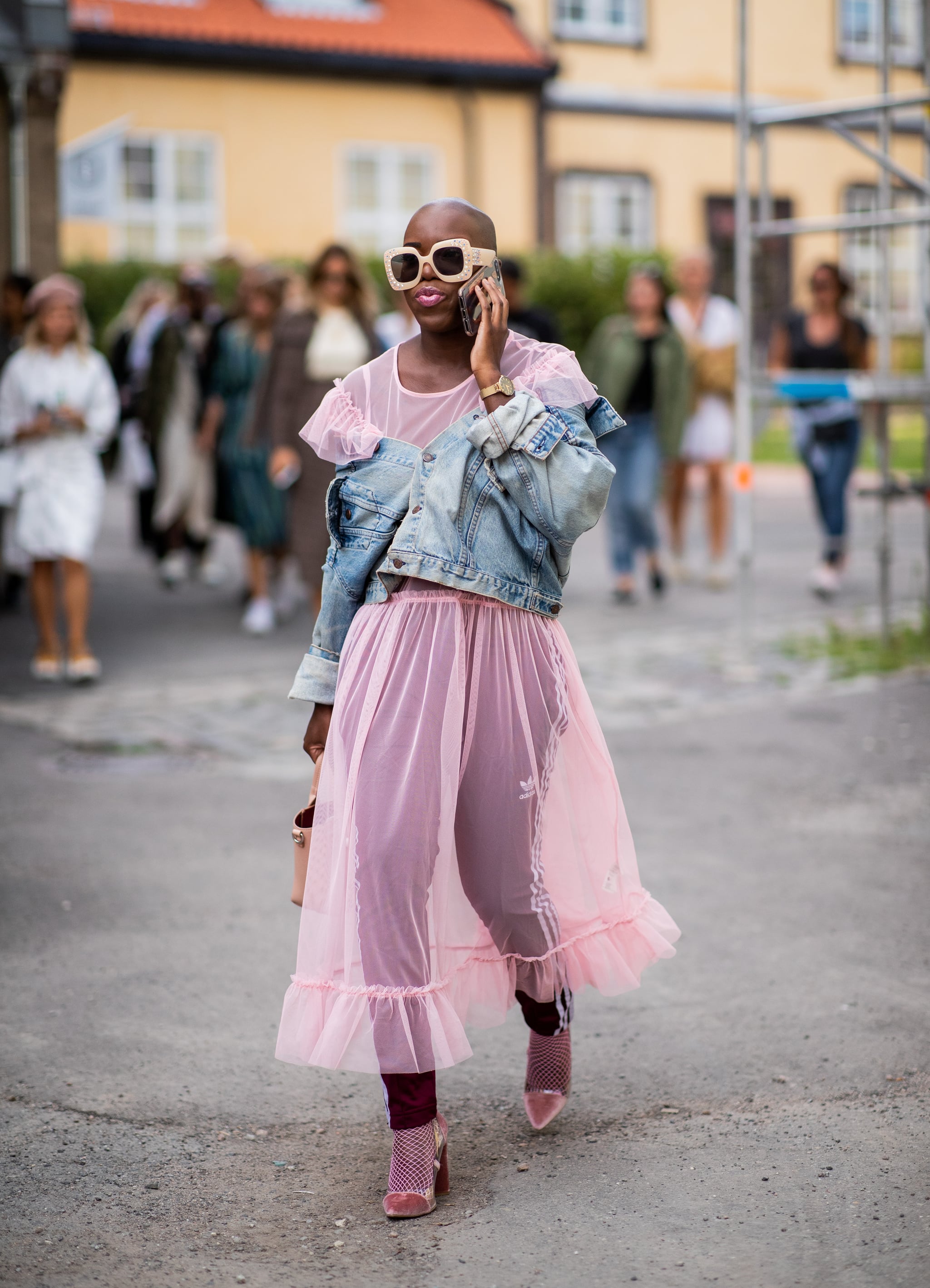 Styling a pink sheer dress with a denim jacket., This Is by Far the  Riskiest Outfit We've Seen at Fashion Week