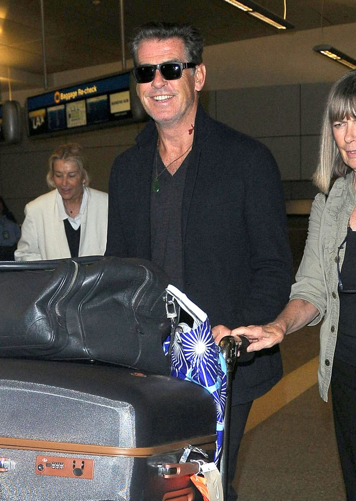 Pierce Brosnan made his way through LAX with a smile on Tuesday.