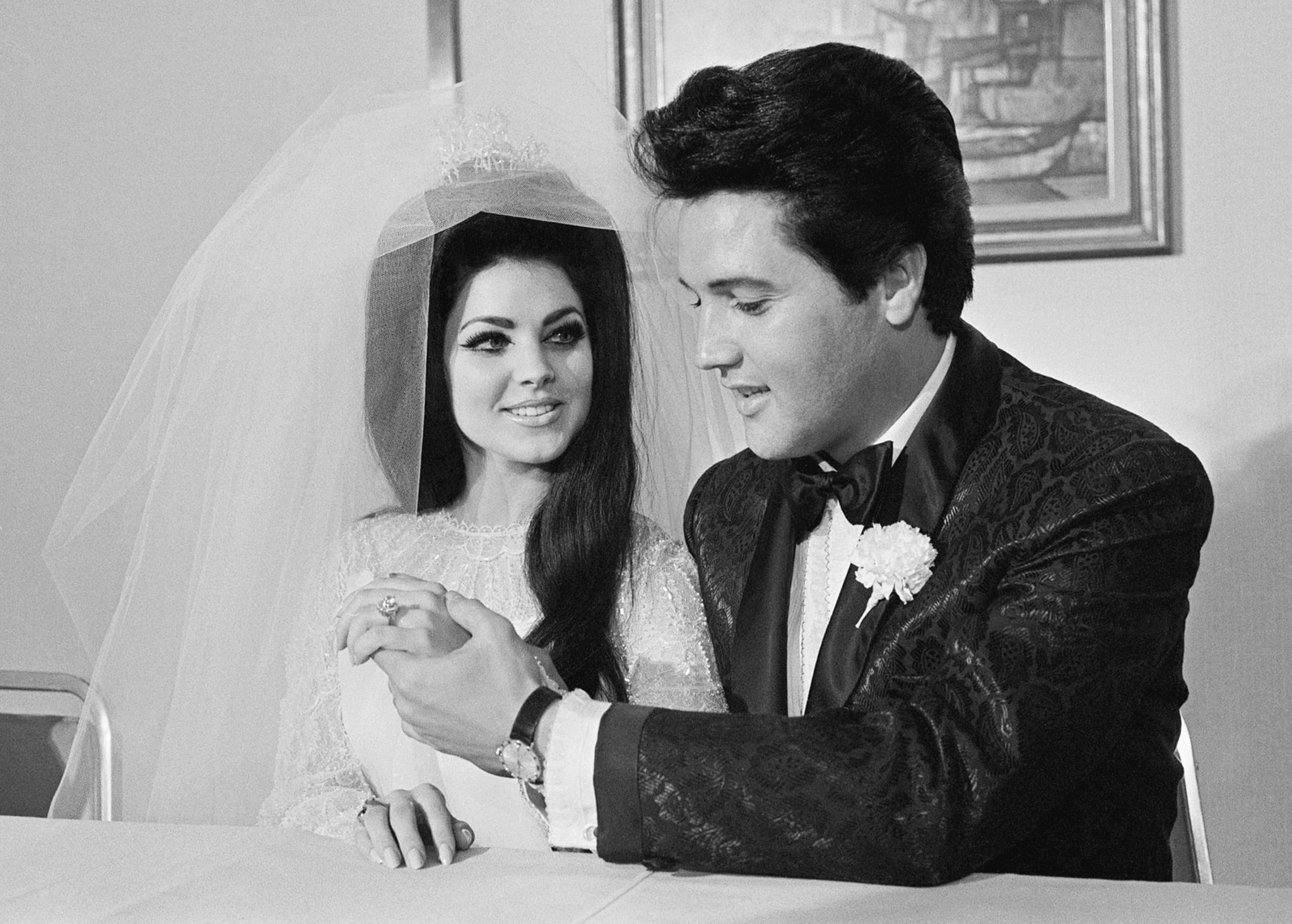 Elvis Presley shows off his wife Princilla's three-carat diamond wedding ring on their wedding day in Las Vegas.