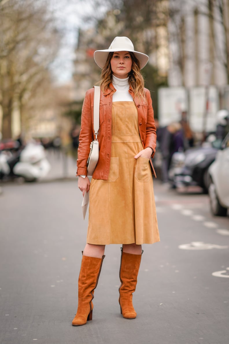 Style Your Dress With a White Turtleneck, Light Jacket, Boots, and a Hat
