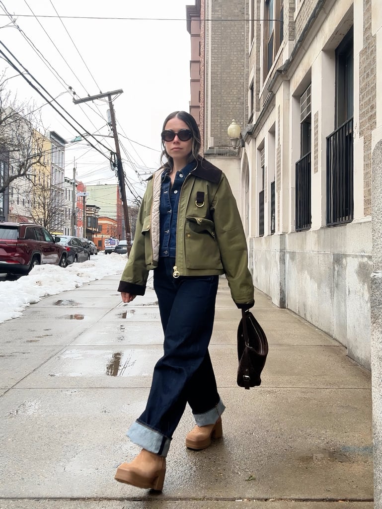 "If I had to picture my perfect middle school outfit with UGGs, it would include a textured baby tee with a ruffle trim, the beloved Solow fold-over pants of yesteryear, and a North Face fleece. Plus braces. Do those count as an accessory? I used to love dragging my feet down the hallways — perhaps purposefully, to draw attention to my shoes — in the Classic Short Boot (I absolutely owned the Fugg version of them in baby blue, too). 
Now, I think of the brand very differently — it's less of a status symbol and more of a quality footwear company that's withstood the test of time. But all it takes is one glimpse of the logo at the back of the heel to spark nostalgia, and that somehow makes me more excited to construct an outfit. The UGG Moxy Chelsea Boots ($170) have a utilitarian feel, so I love teaming them with boxy pieces like my Barbour, Levi's barrel jeans, Asos denim jacket, and Stand Oil Mushy bag. The result is an effortlessly rugged-chic look that I can play up with personal touches, like my Marc Jacobs oval sunglasses. It's a very different vibe nowadays, but I've realized one thing hasn't changed: my UGGs still feel like the security blanket of the whole outfit." — Sarah Wasilak, shopping director